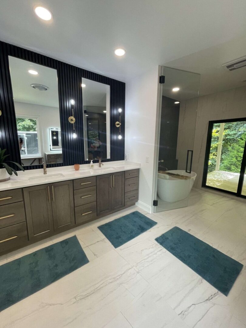 A bathroom with two sinks and a large mirror.