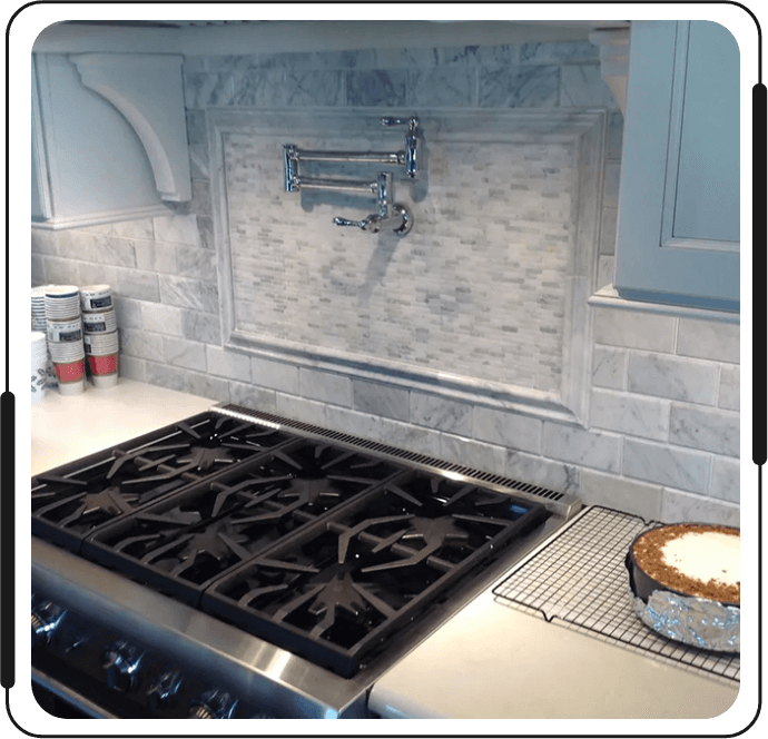 A stove top oven sitting in the middle of a kitchen.