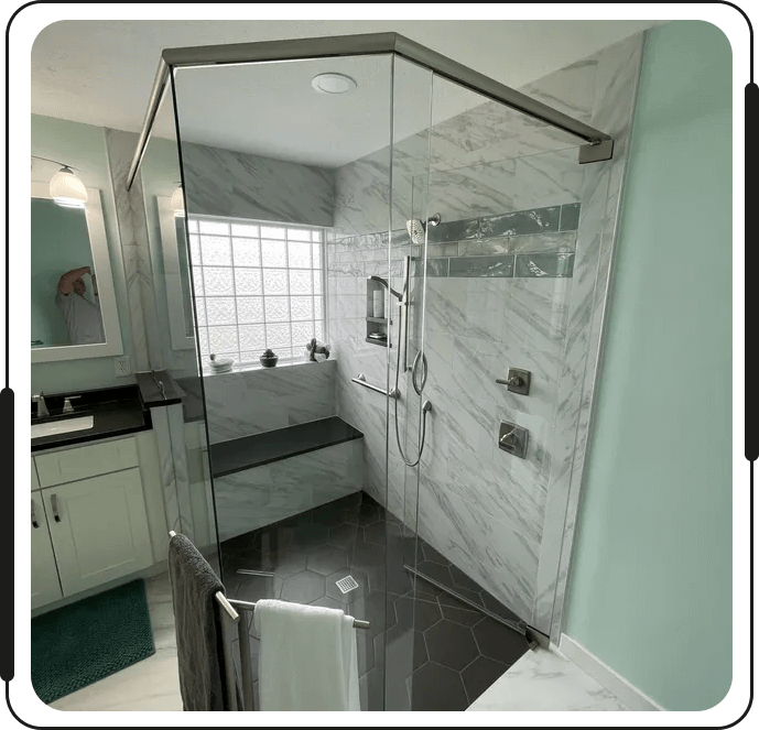 A bathroom with a shower and tiled walls.