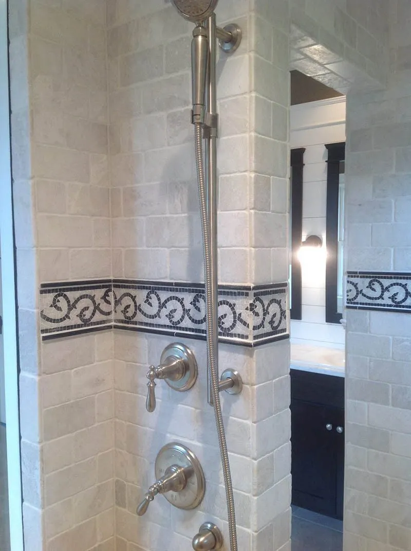 A bathroom with tiled walls and floors