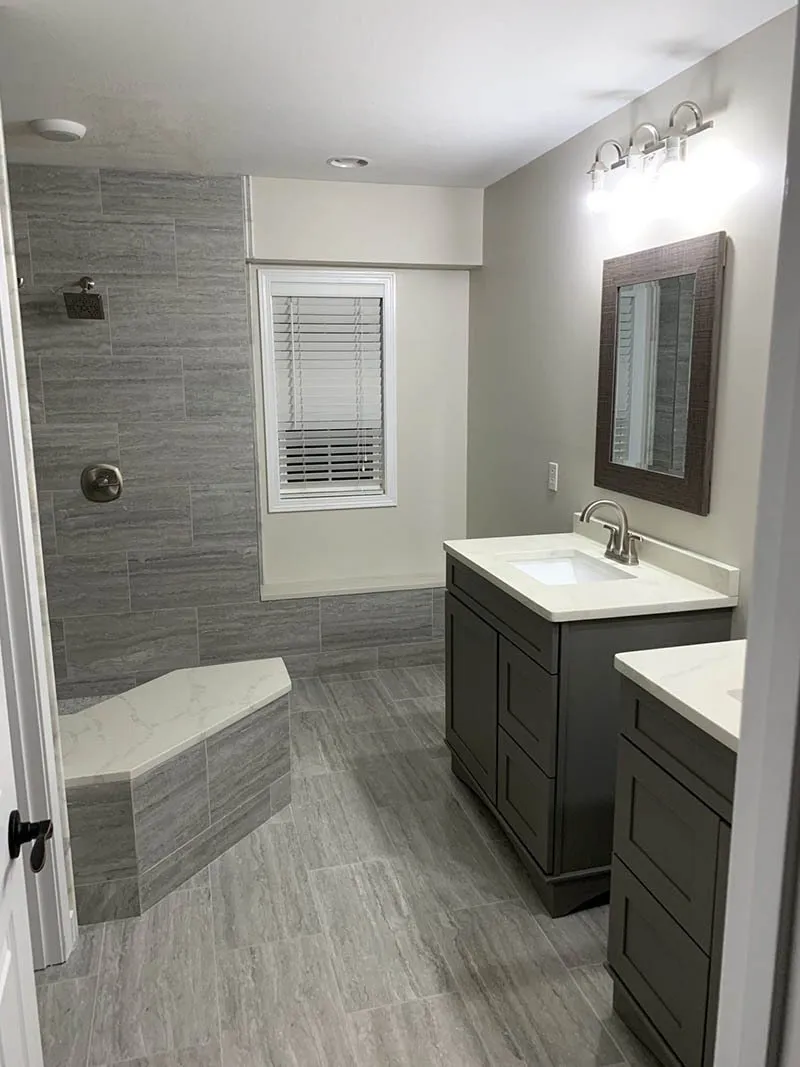 A bathroom with a sink, toilet and bathtub.